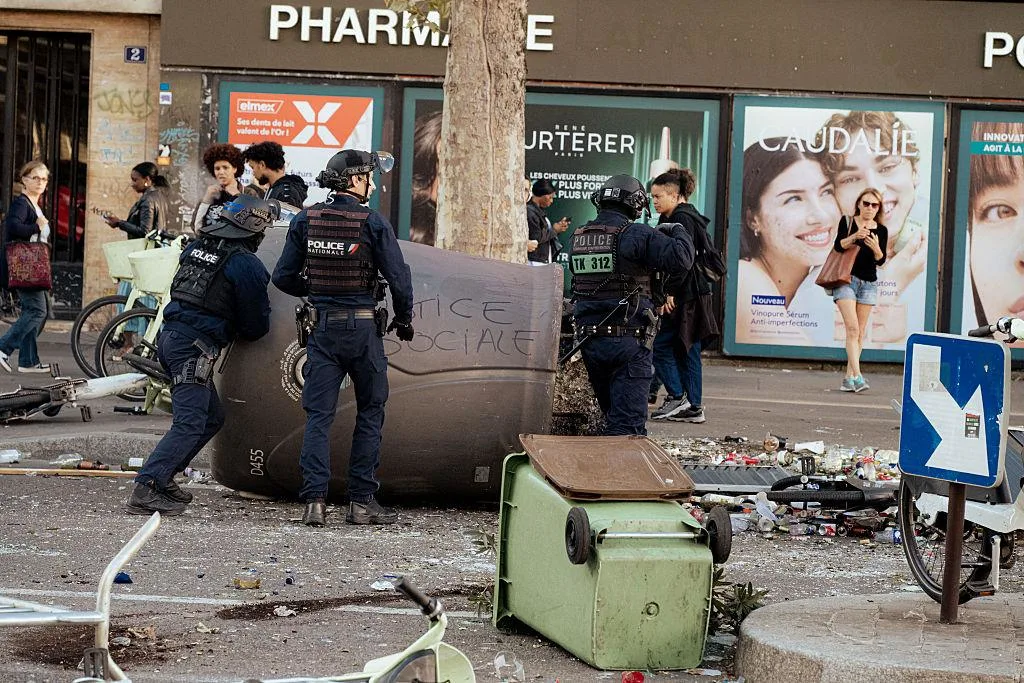 Arrests: 855 detained in Paris and over 1,800 total across France.