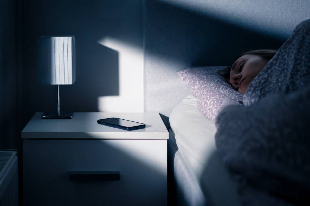 A person sleeping soundly with an audio app playing in the background.