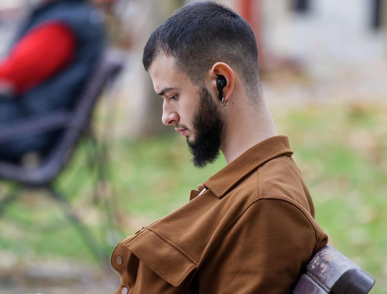 Photo of man with Earbuds. Earbuds sit deep in the ear canal and you must choose best one because its in first layers in your ears.
