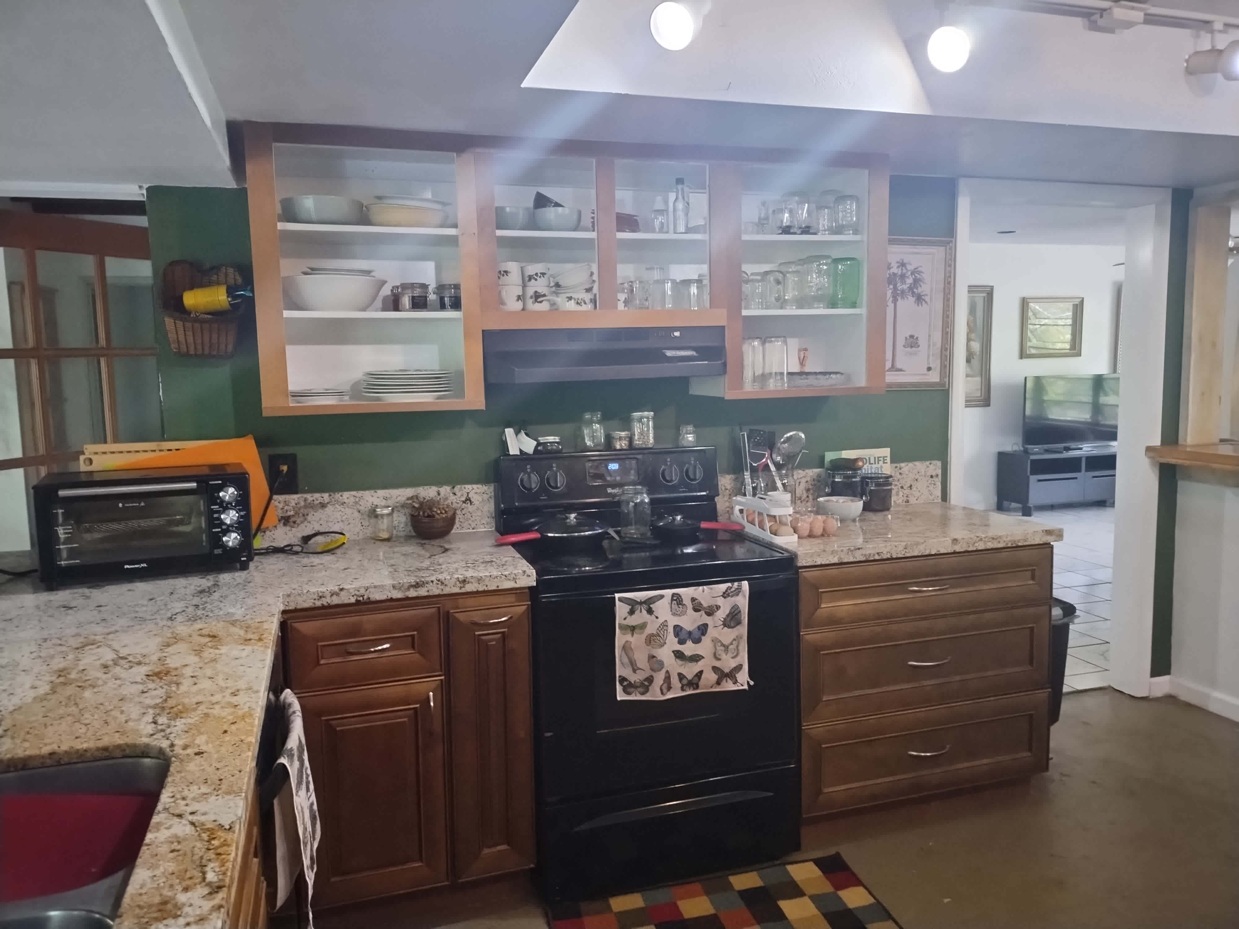 Kitchen was redone with reclaimed wood cabinets and granite countertops. Drawers are soft close.  