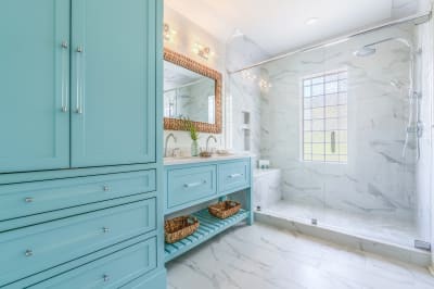 Spacious walk-in shower with glass door