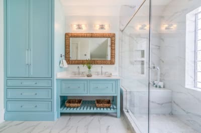 Freestanding bathtub near window with natural light