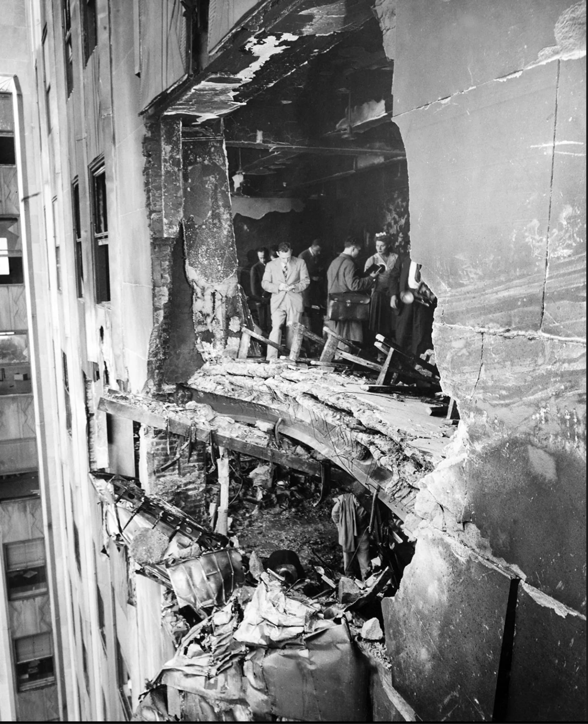 The aftermath of the B-25 Marshall’s impact into the building. The aftermath of the B-25 Marshall’s impact into the building.