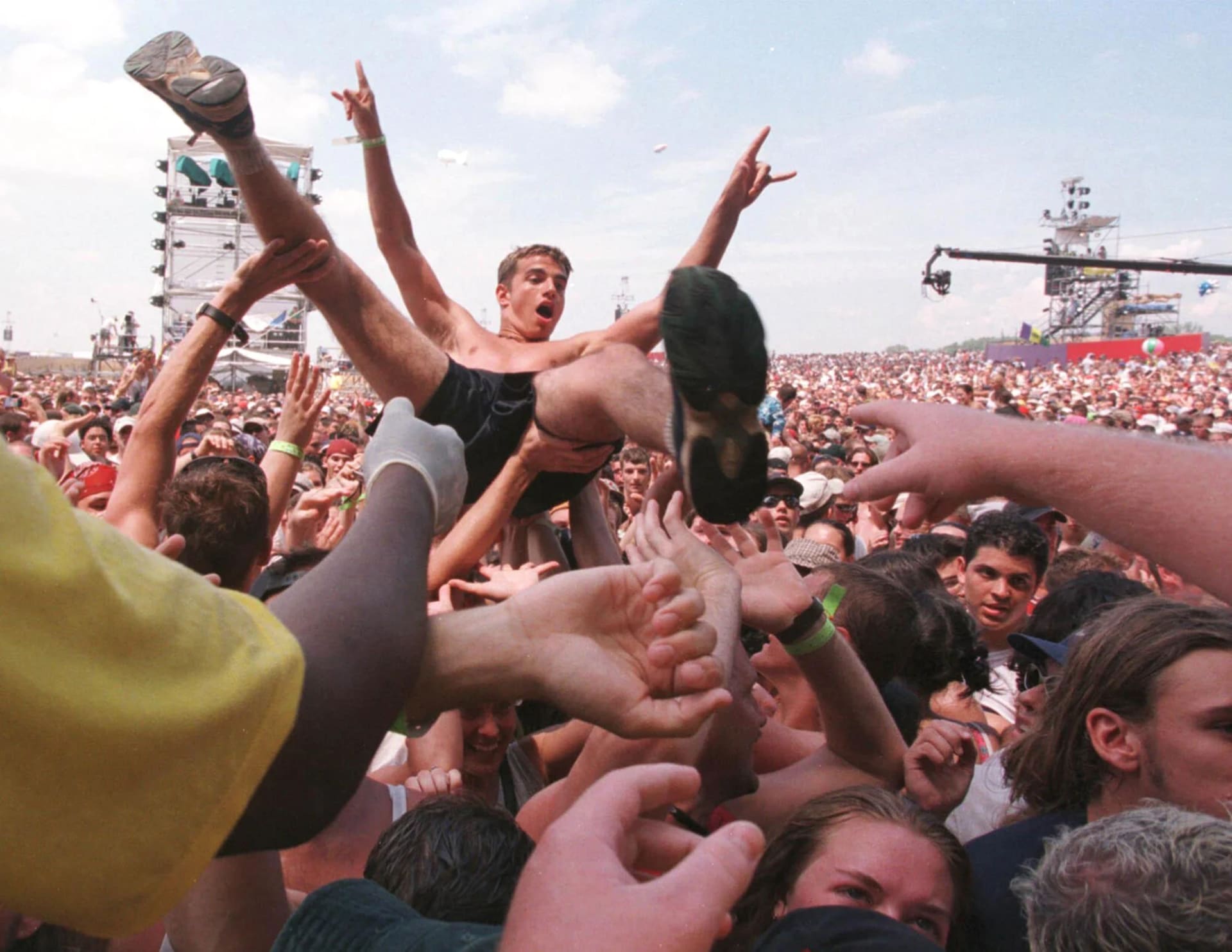 One of many crowd surfers during Woodstock ‘99. One of many crowd surfers during Woodstock ‘99.