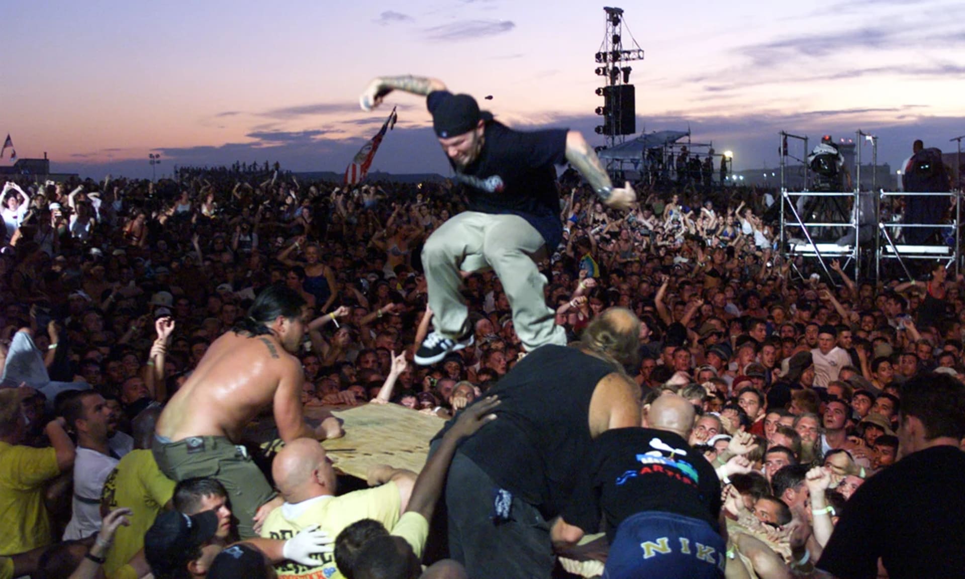 Limp Bizkit frontman Fred Durst crowd surfing on a piece of plywood. Limp Bizkit frontman Fred Durst crowd surfing on a piece of plywood.