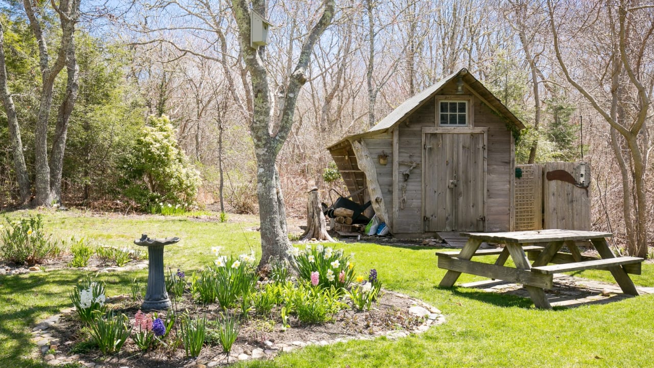 Garden, wood shed with neat outdoor shower.