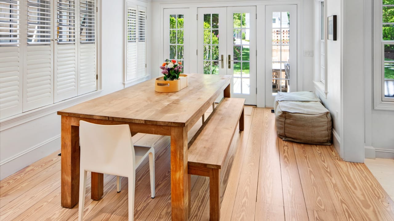 Open dining room with beautifully restored floors
