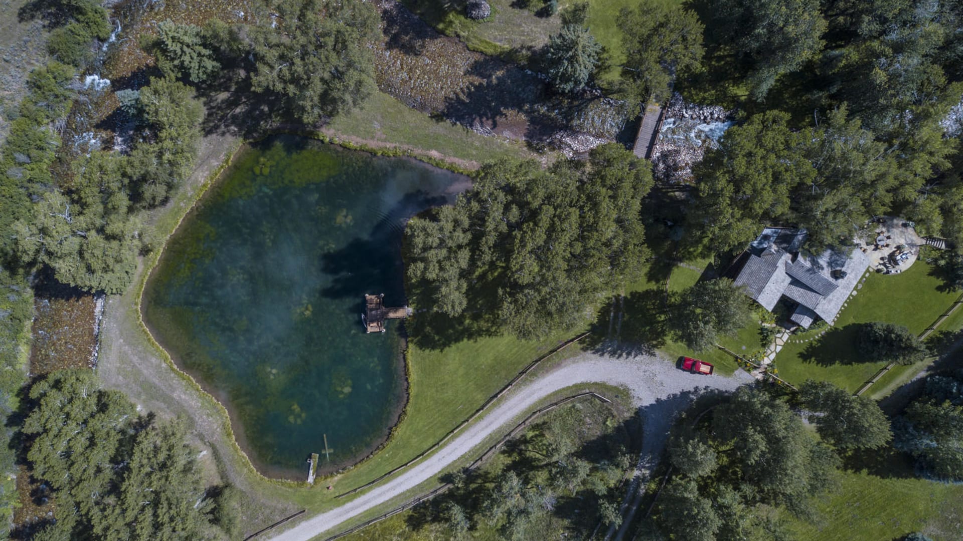 Aerial above pond & cabin
