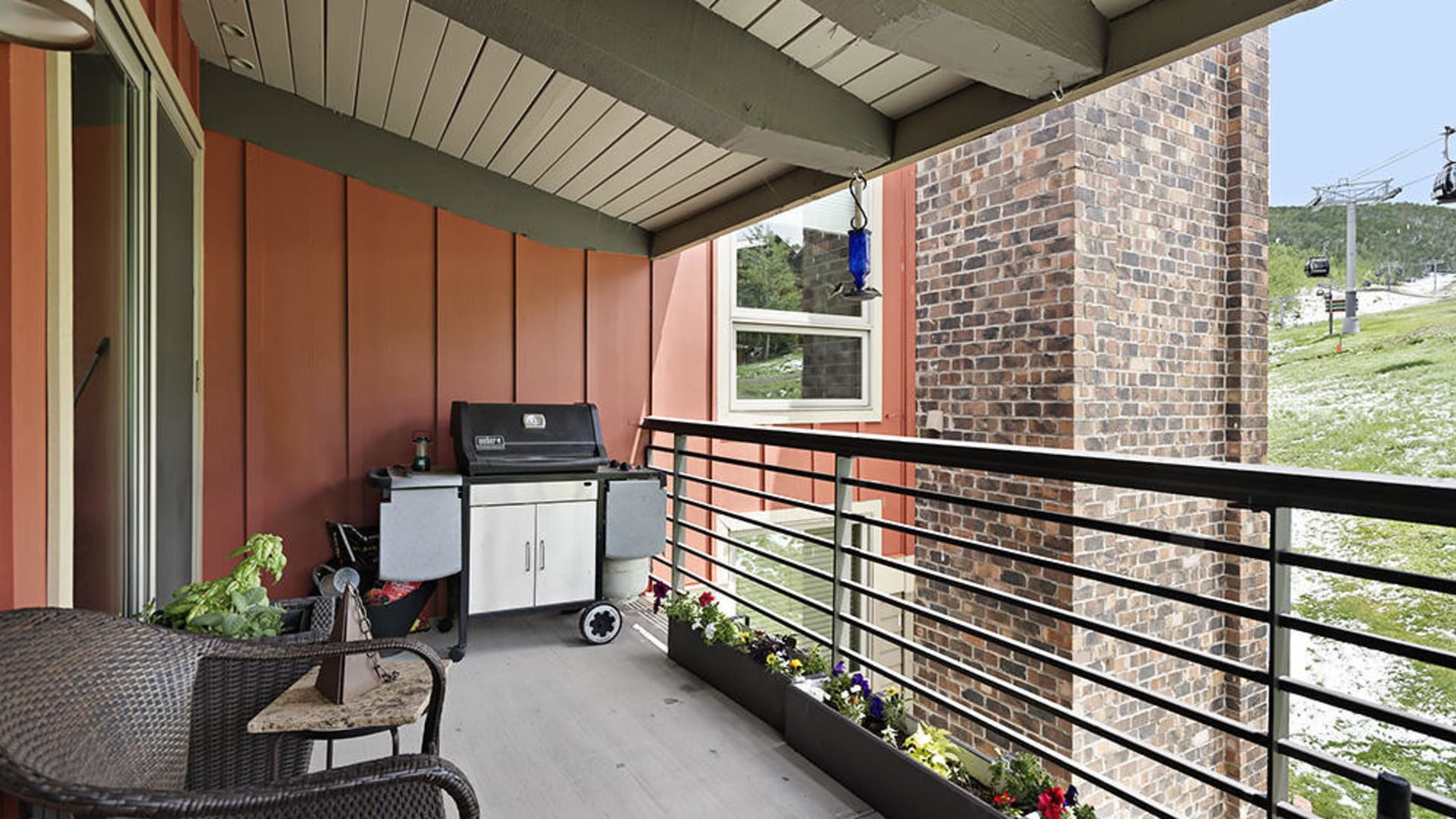 Large deck spans living room and master