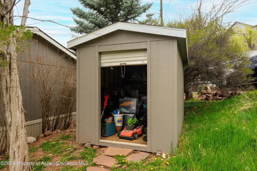 Storage Shed with rolling access door