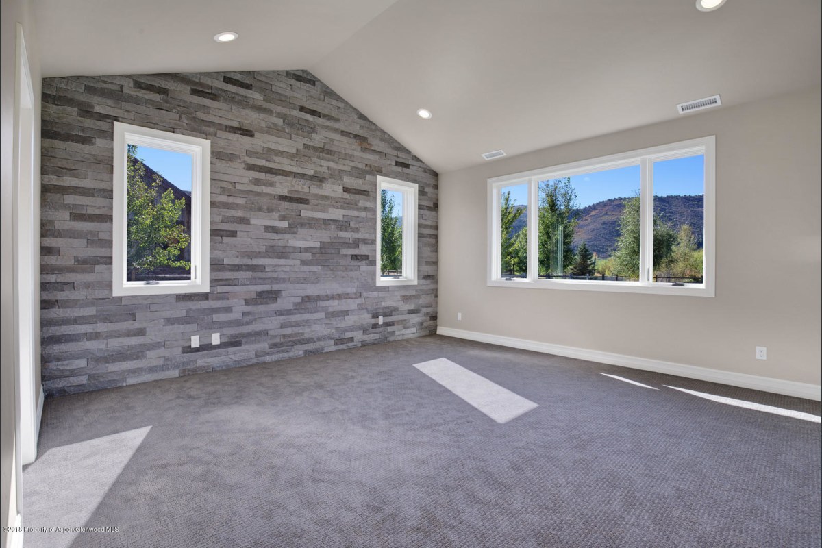 Stone accent wall in Master Bedroom