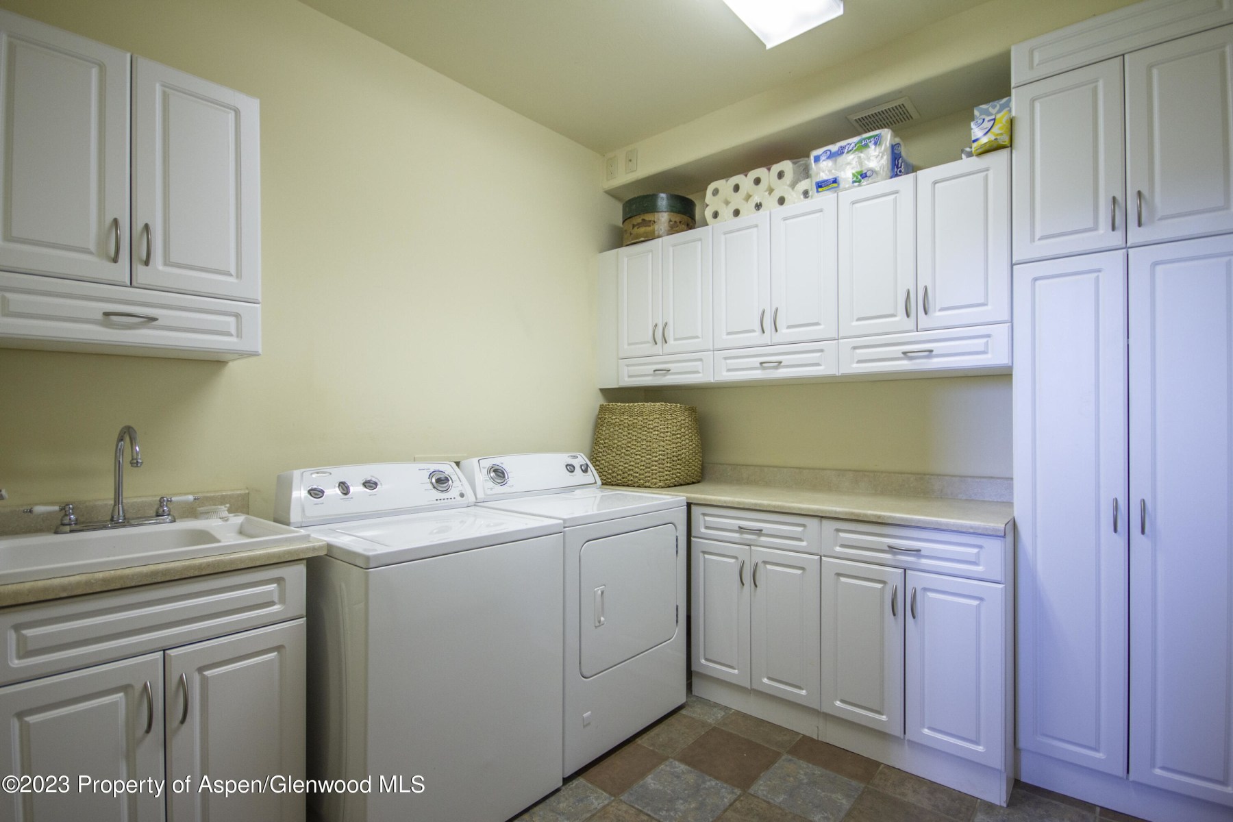 laundry room with storage