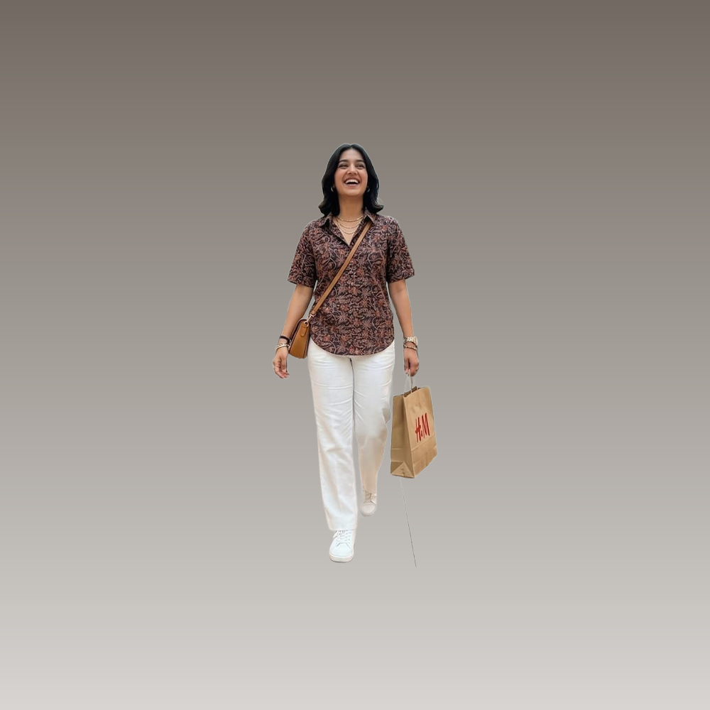 A flat lay image of the UrbanShilp Kalamkari Cotton Shirt paired with neutral trousers and minimal accessories, demonstrating styling options.