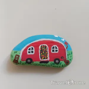 Painted painting stone by artist nad_doodles showing landscape. Camper.