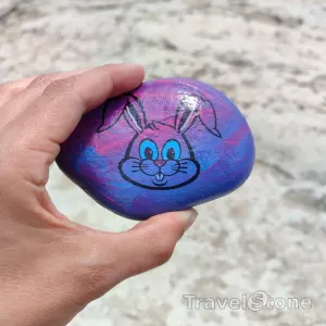 Painted painting stone by artist CJ showing animals. TravelStone Bunny.
