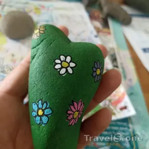 Painted painting stone by artist comfortinstones showing plants. Be spring.