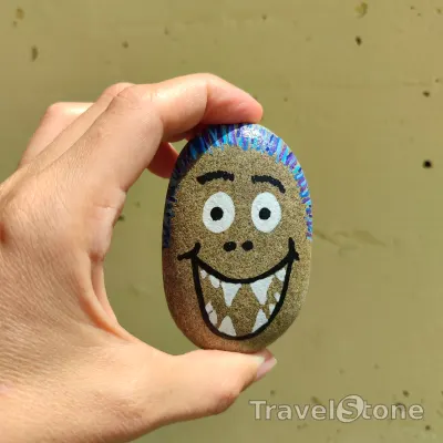 Painted painting stone by artist 007 showing fantasy. Travelstone monster.