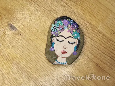 Painted painting stone by artist nad_doodles showing people. Viva la Frida .