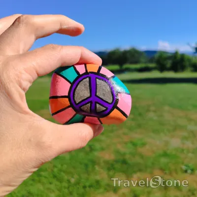 Painted painting stone by artist LaLiLu showing fantasy. Peace TravelStone.