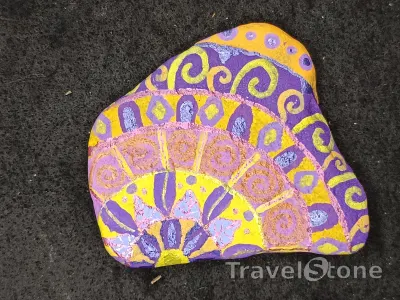 Painted painting stone by artist nad_doodles showing pattern. Mandala lila gelb.