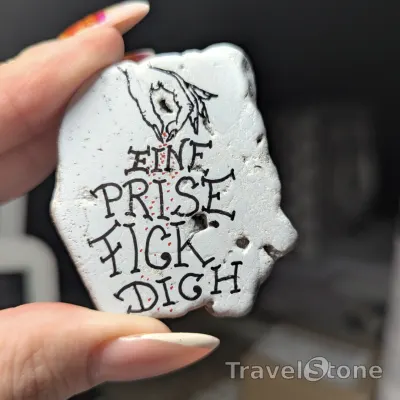 Painted painting stone by artist heidi showing sayings. Mit Humor: der eine Prise fick dich stein.