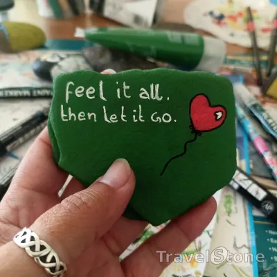 Painted painting stone by artist comfortinstones showing sayings. Feel it all. Then let it go. .