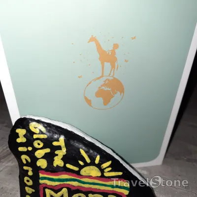 Painted painting stone by artist Armani showing special occasion. Mona sunset - let me be your light.