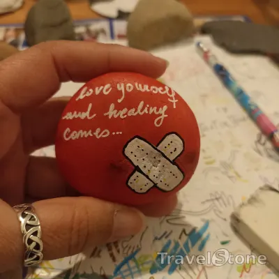 Painted painting stone by artist comfortinstones showing other. Love yourself and healing comes.