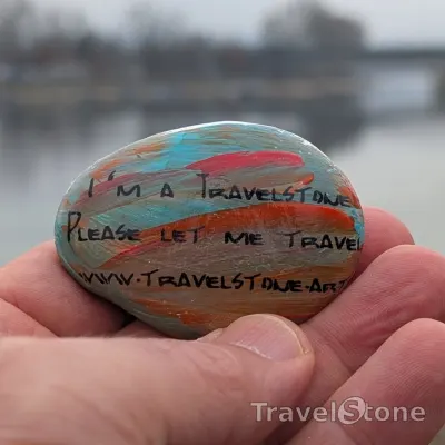 Painted painting stone by artist CJ showing sayings. Let me travel.