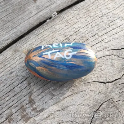 Painted painting stone by artist CJ showing sayings. Mach den Tag zu Deinem.