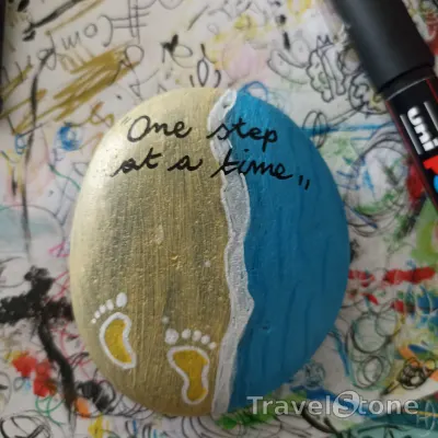 Painted painting stone by artist comfortinstones showing sayings. One step at a time .
