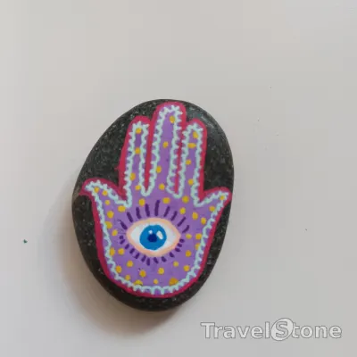 Painted painting stone by artist nad_doodles showing other. Hamsa Hand .