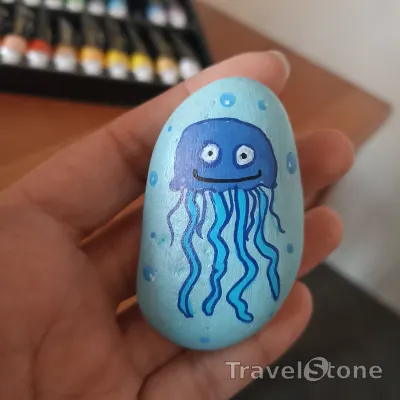 Painted painting stone by artist comfortinstones showing animals. Jellyfish .