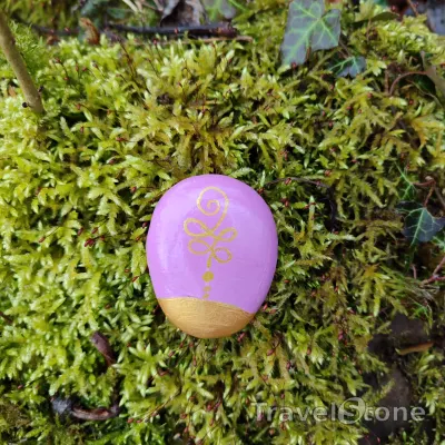 Painted painting stone by artist CJ showing other. Unalome painting.