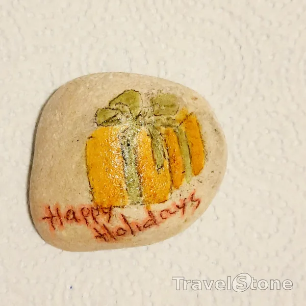 Painted painting stone by artist Anastasiia showing special occasion. Зроблений підчас подорожі в Празі