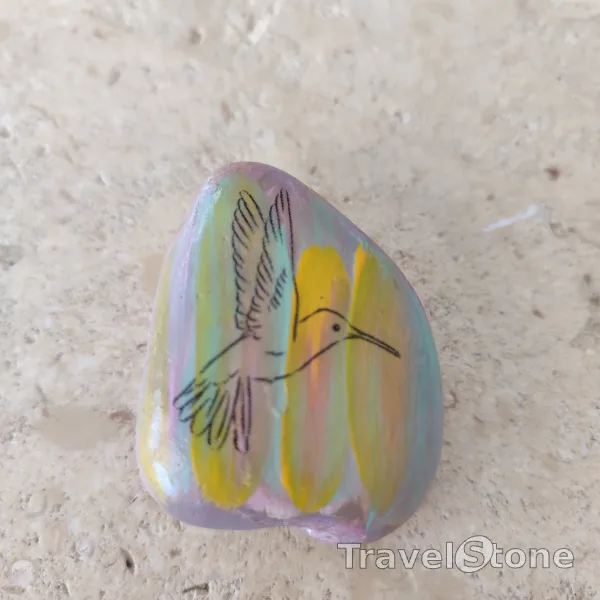 Painted painting stone by artist CJ showing animals. Bird TravelStone