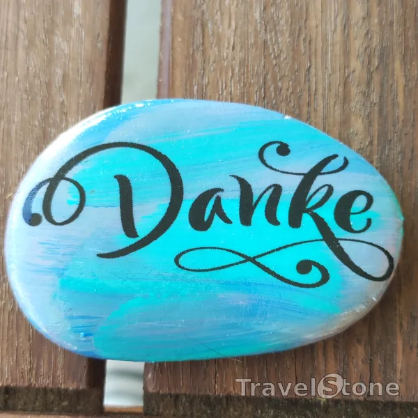 Painted painting stone by artist LaLiLu showing sayings. Danke
