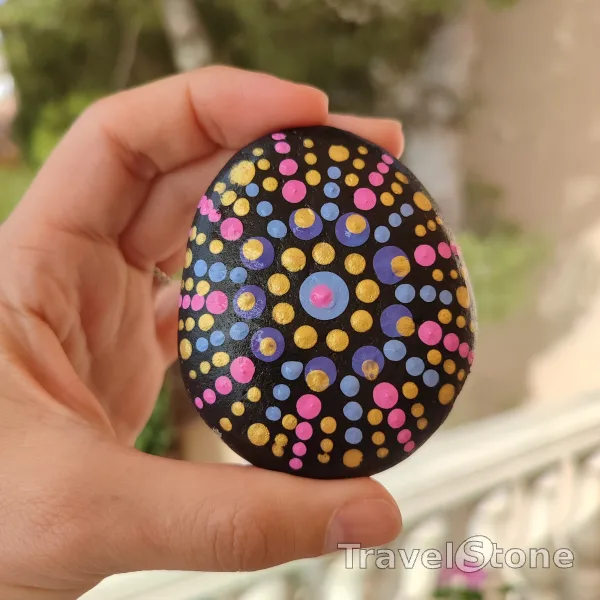 Painted dotting stone by artist CJ showing pattern. Mandala
