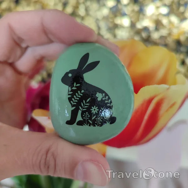 Painted painting stone by artist LaLiLu showing special occasion. Easter TravelStone