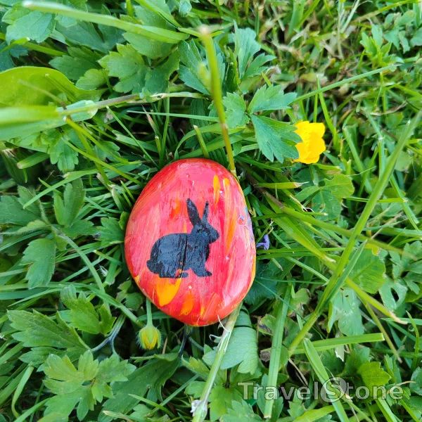 Painted painting stone by artist LaLiLu showing special occasion. Easter TravelStone