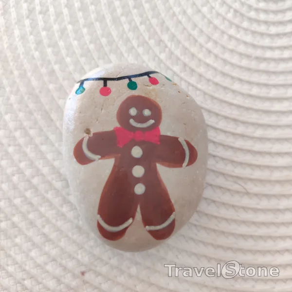 Painted painting stone by artist CJ showing special occasion. Cookie TravelStone