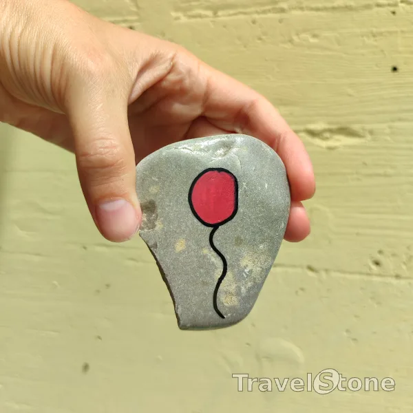 Painted painting stone by artist 007 showing fantasy. Balloon TravelStone