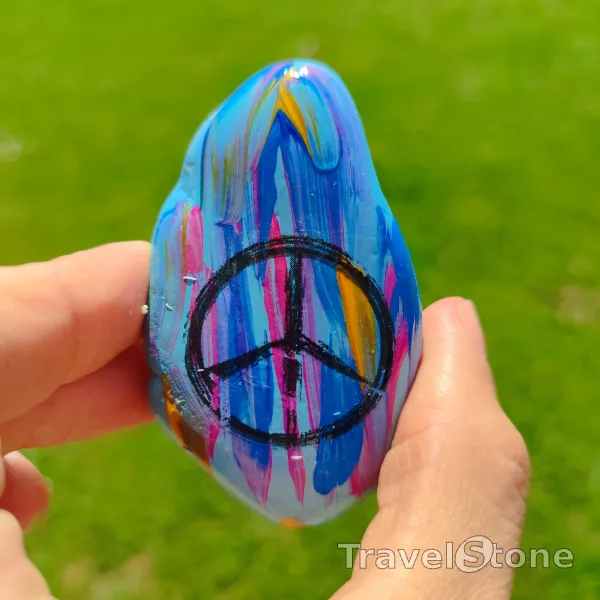 Painted painting stone by artist LaLiLu showing fantasy. TravelStone travels for peace