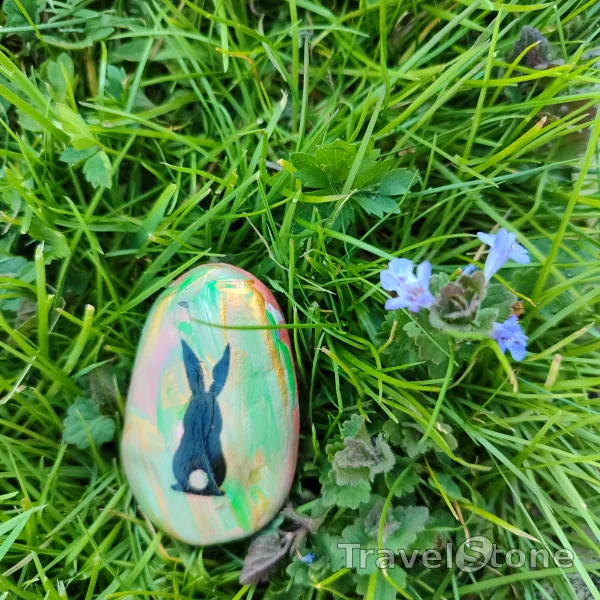 Painted painting stone by artist LaLiLu showing special occasion. Easter TravelStone