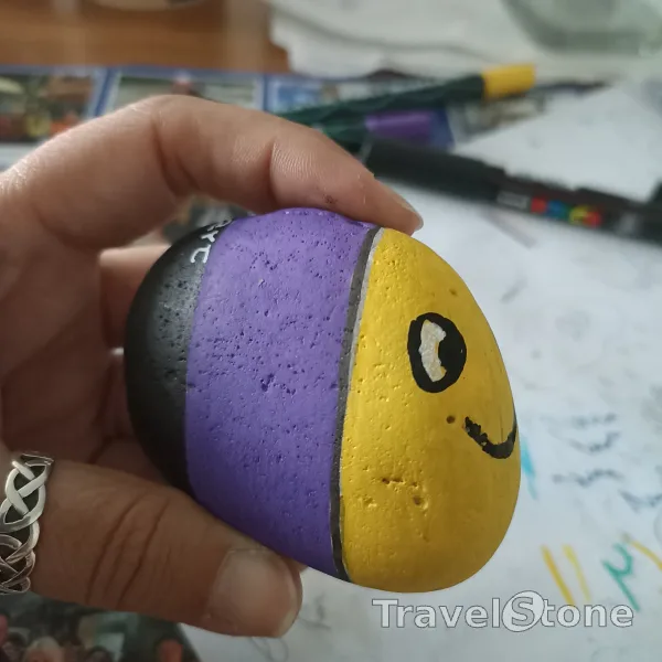 Painted painting stone by artist comfortinstones showing animals. A colourful Fish