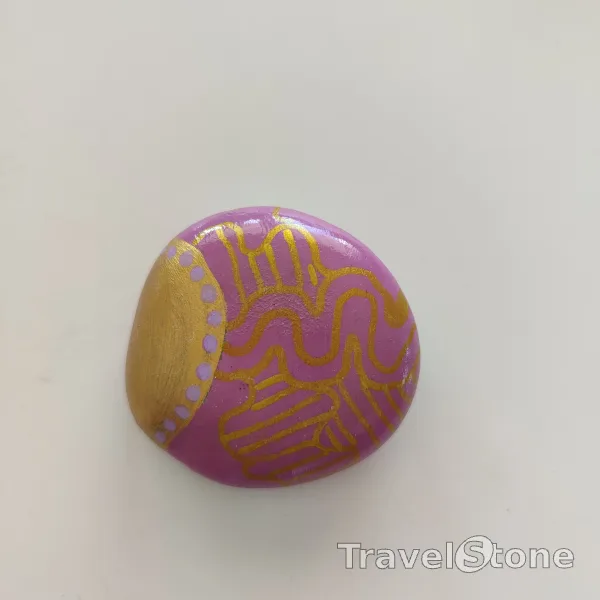 Painted painting stone by artist Ella showing pattern. Copper and pink painted stone