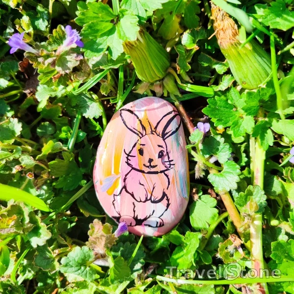 Painted painting stone by artist LaLiLu showing special occasion. Easter TravelStone