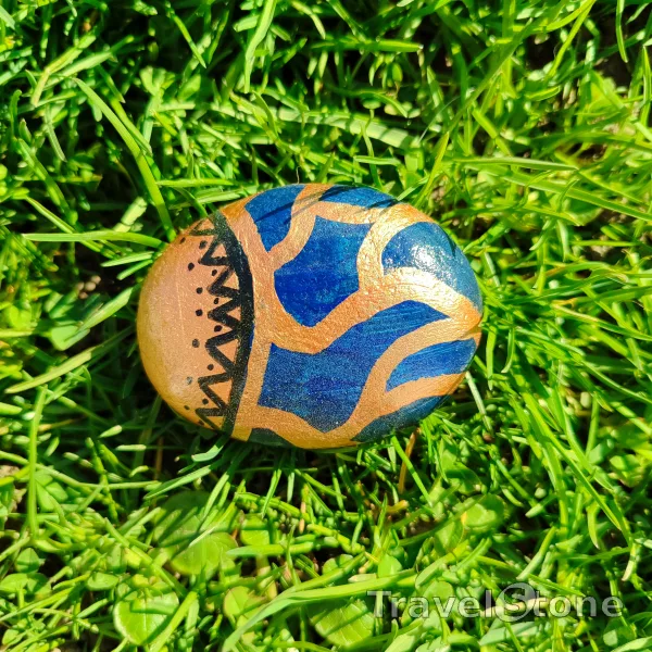 Painted painting stone by artist 007 showing pattern. Patzern in copper and dark blue colors