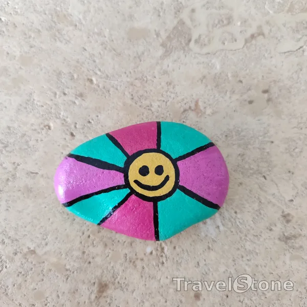 Painted painting stone by artist CJ showing pattern. Smiley TravelStone