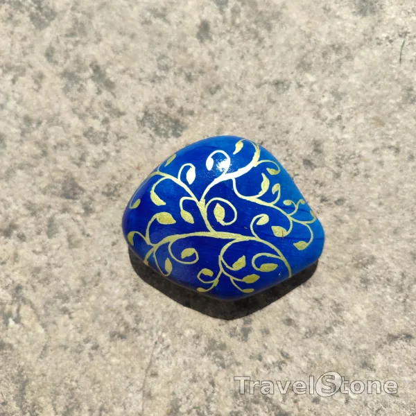 Painted painting stone by artist 007 showing pattern. Dark blue and gold TravelStone